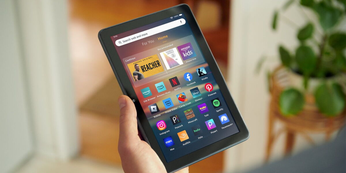 Hand holding an Amazon Fire HD 8 tablet